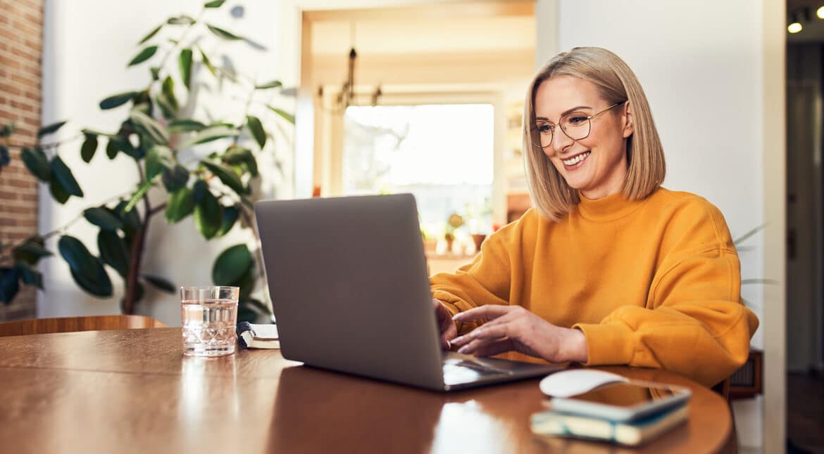 Woman accessing the internet from her laptop.