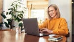 Woman accessing the internet from her laptop.